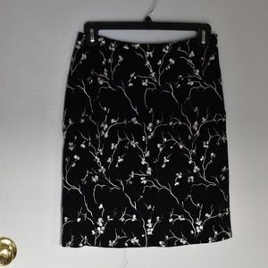 Black & flower embroidered skirt by Nicole Miller